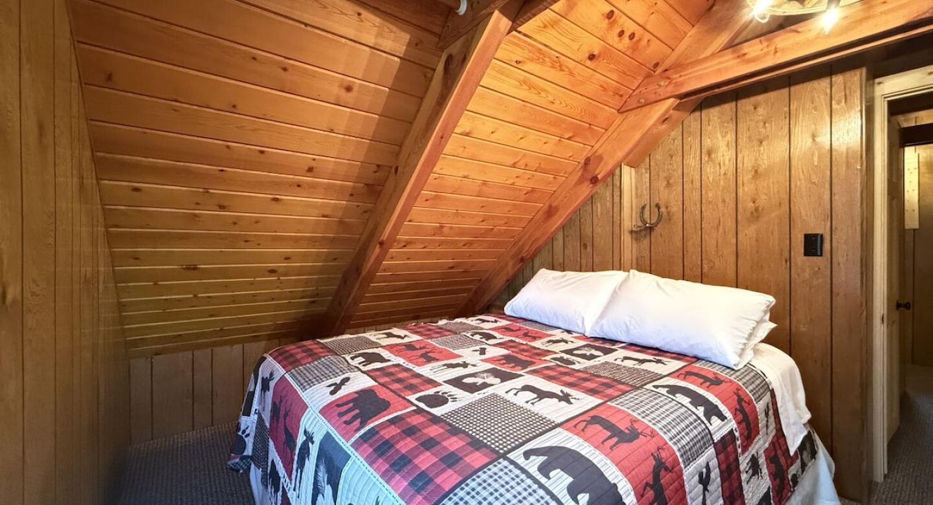 Bedroom #3 located upstairs with a queen size bed.