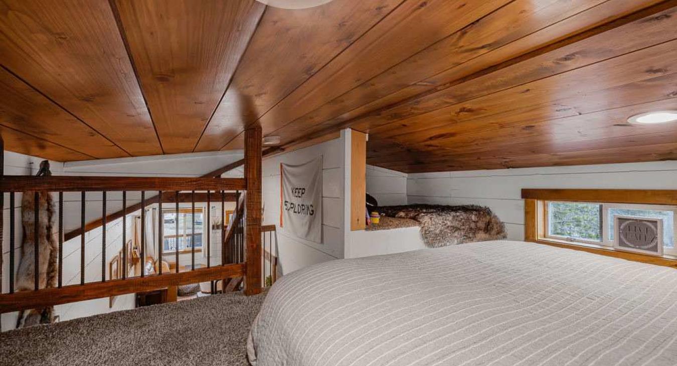 Queen bed in the open loft area.