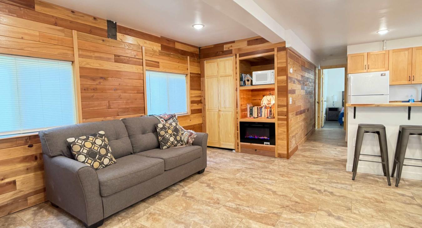 Living room area with Queen sofa sleeper.