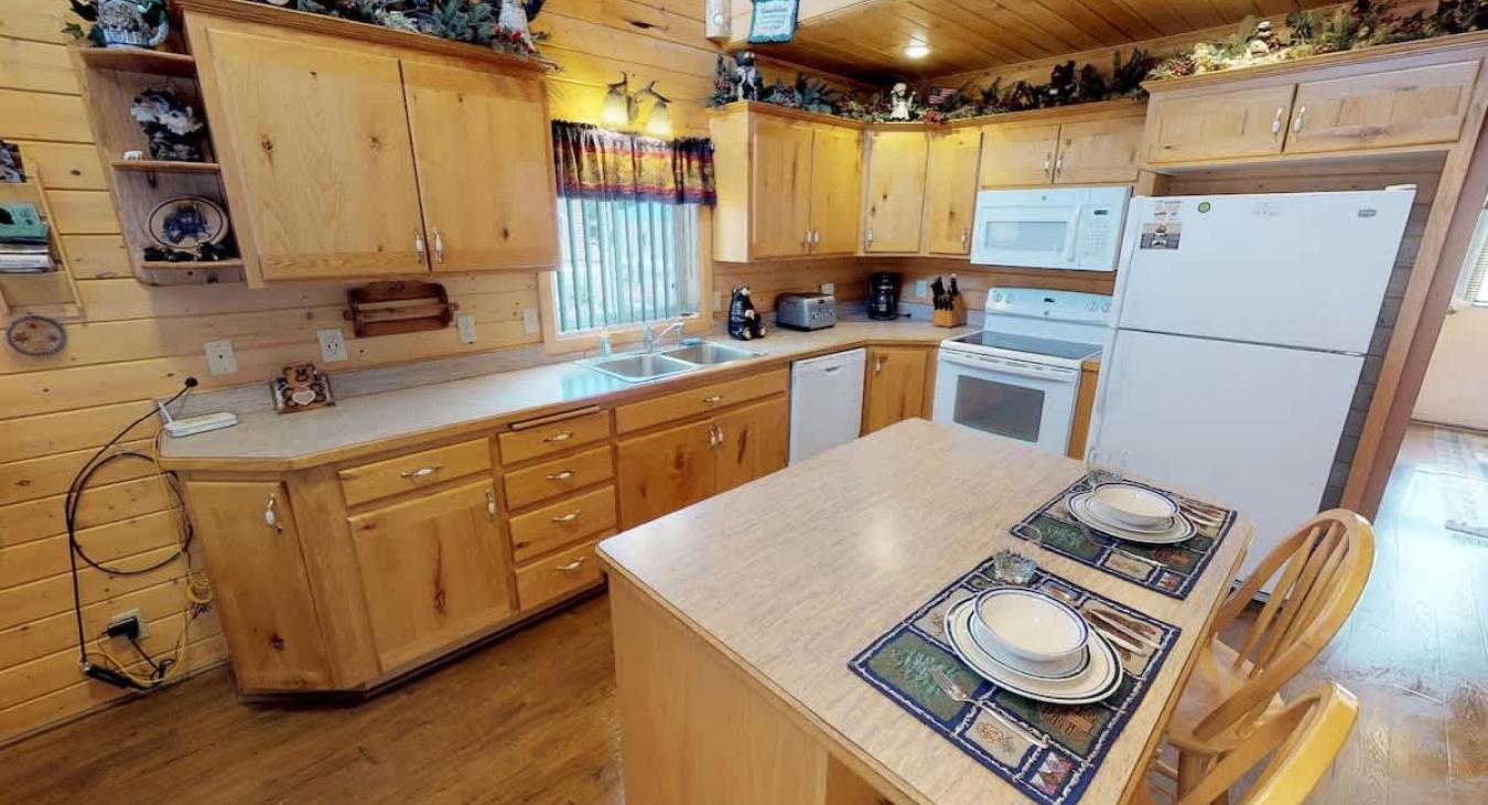 Full size kitchen with appliances, cookware, pots and pans, dishes, utensils, and basic cooking essentials.