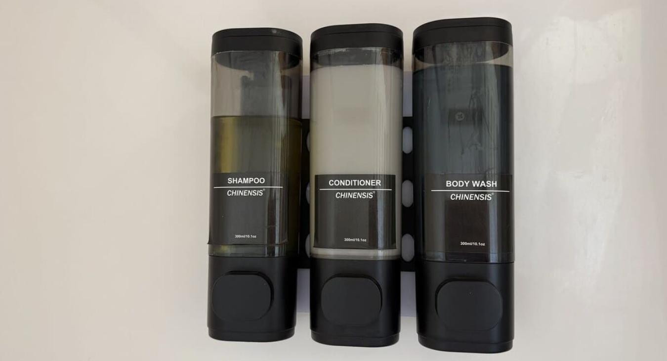 Shampoo, conditioner and body wash are provided in the dispensers.