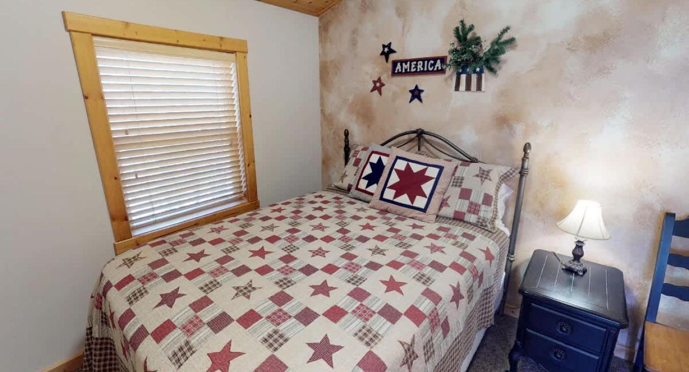 A moderately sized window—framed in wood—lets in morning light and gives a peek at the trees or landscape outside.