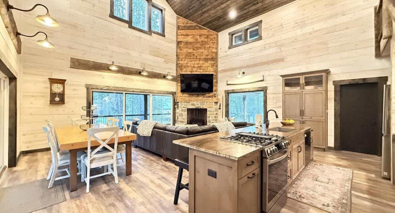 Dining room area with seats for 8 with additional seating at the kitchen island.