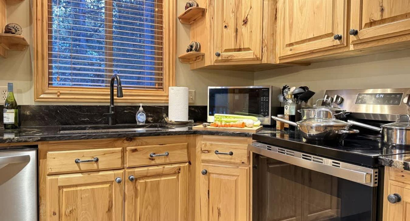 It’s the kind of kitchen where a pot of chili simmers while someone pours hot cider, and the sound of laughter echoes through the rafters. A mix of rugged charm and functional elegance.