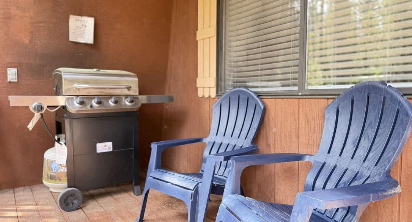 chairs and grill on the front deck.