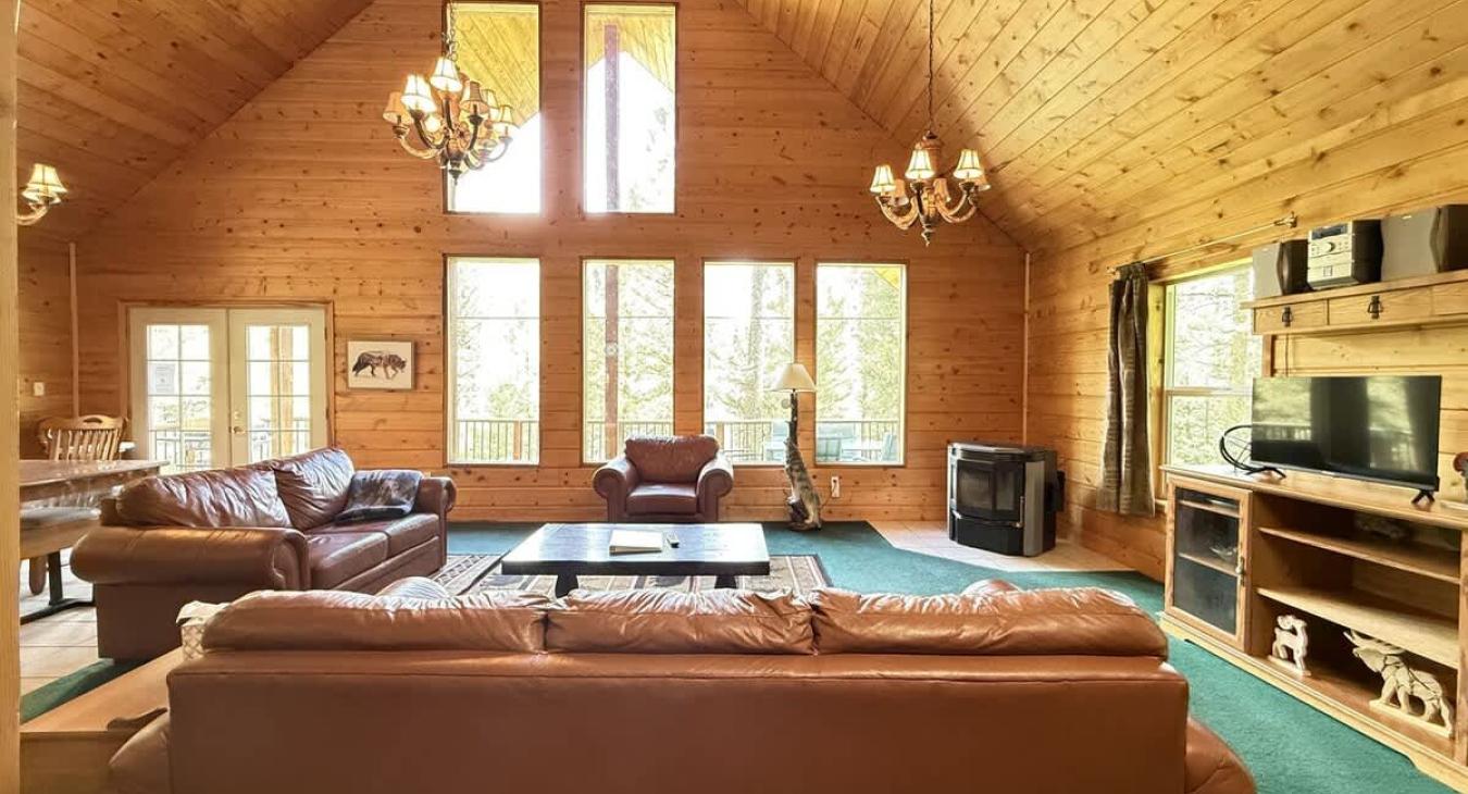 Spacious living room with fireplace for you to cozy up after a long day.