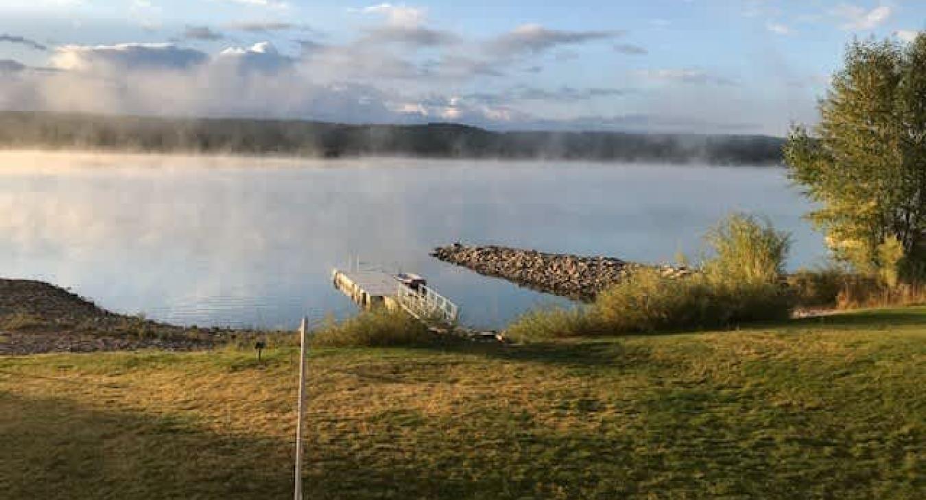 Whether snuggled by a crackling fireplace inside or soaking up sunrise from the deck, the view is an idyllic blend of forest, river, and reservoir — truly Island Park at its finest.