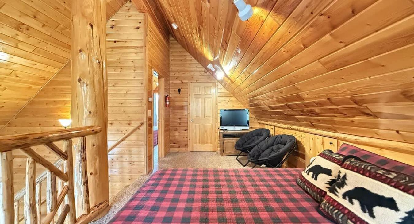 Upstairs loft with 2 queen beds to comfortably sleep 4 people.