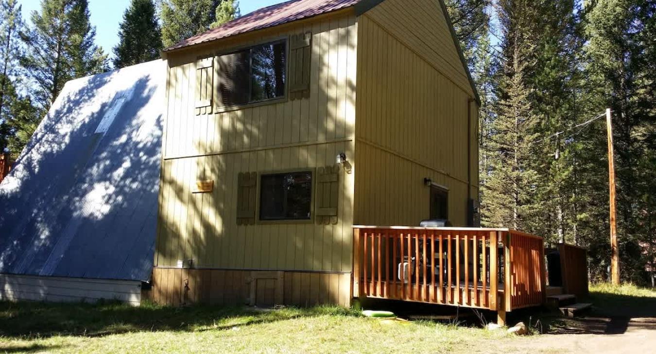 The deck is attached to the cabin with a grill for you to use.