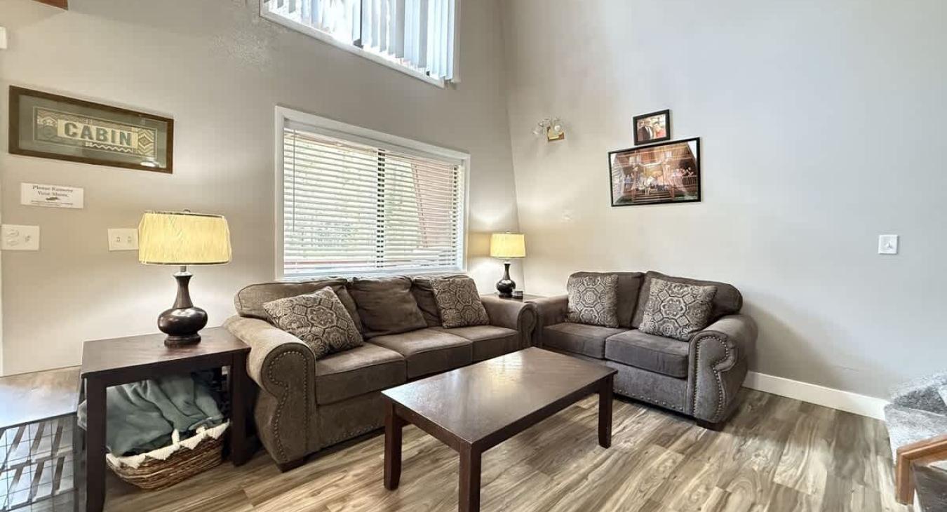 The living room near the kitchen in our cabin has a homey feel. Kick back and relax during your stay at The ALY Legacy Cabin.