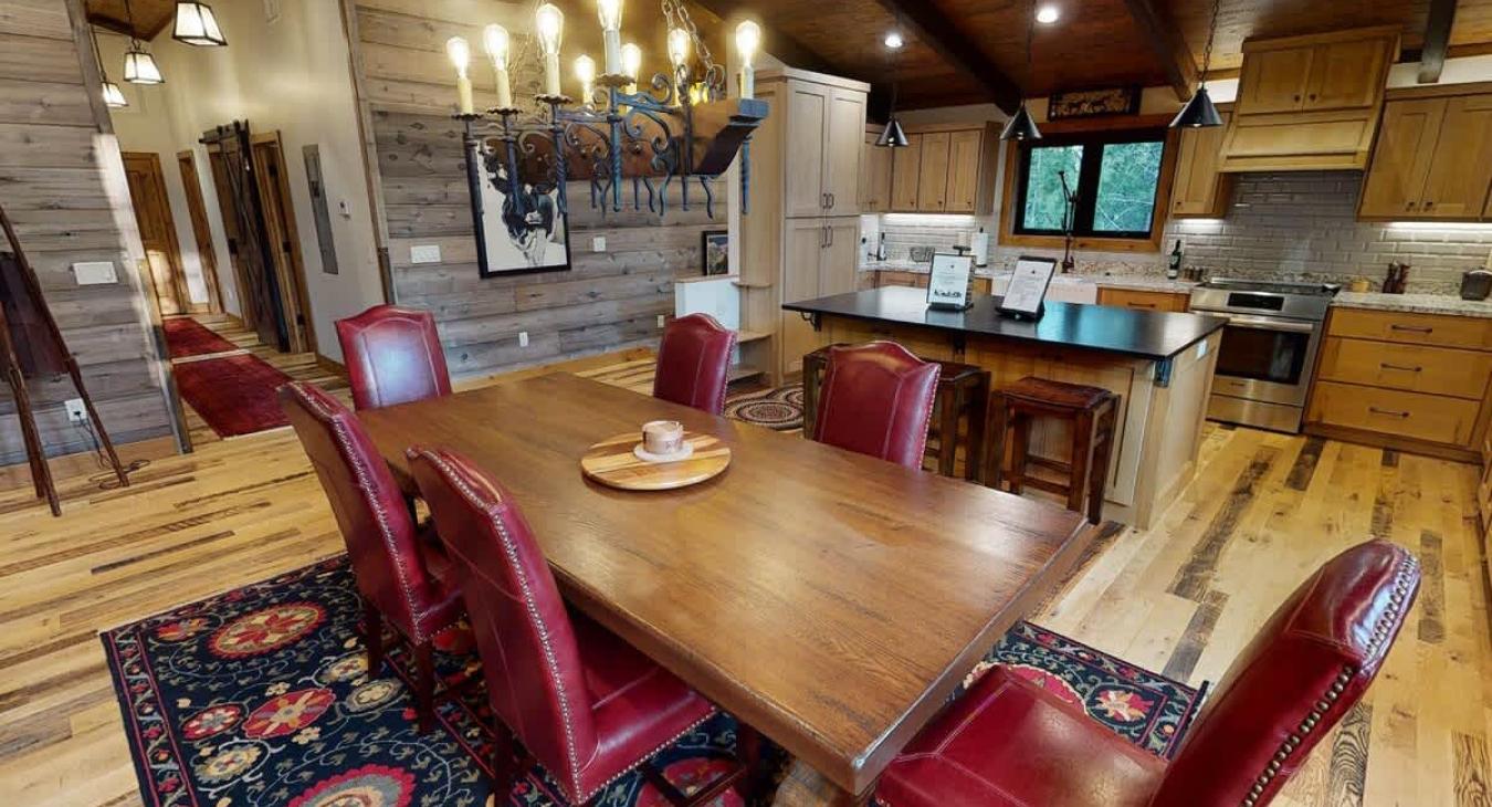 Dining table seats 6 with extra seating at the kitchen island.