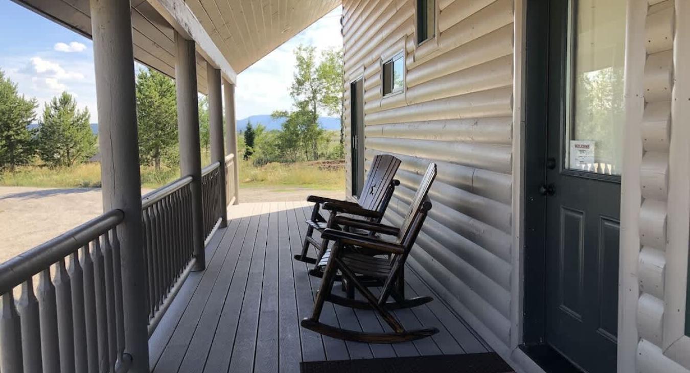 Patio with seating to enjoy the beautiful landscapes of the cabin.