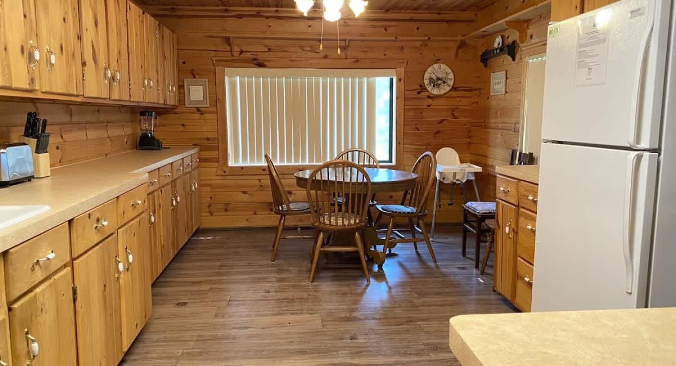 Large kitchen with additional dining table for 4