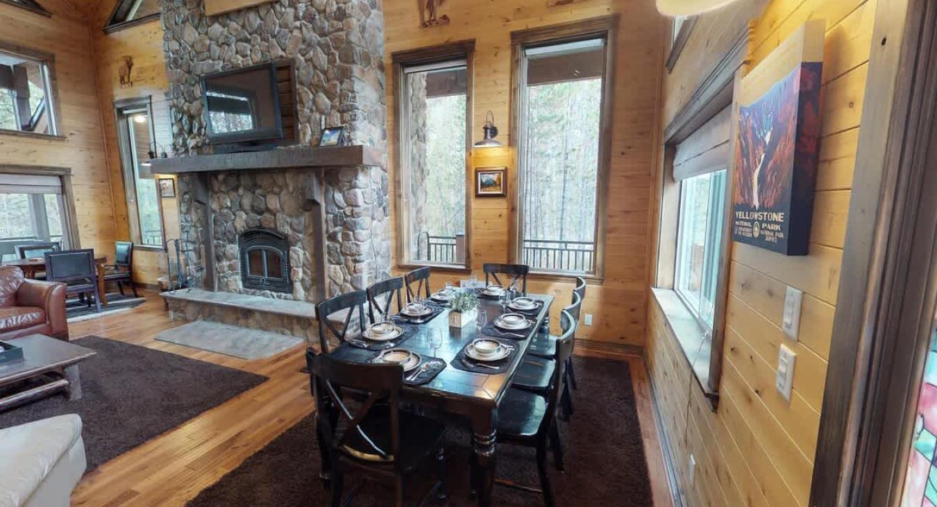 A full size dining table that seats up to 8 people. Additional seating is available at another table and the kitchen island.