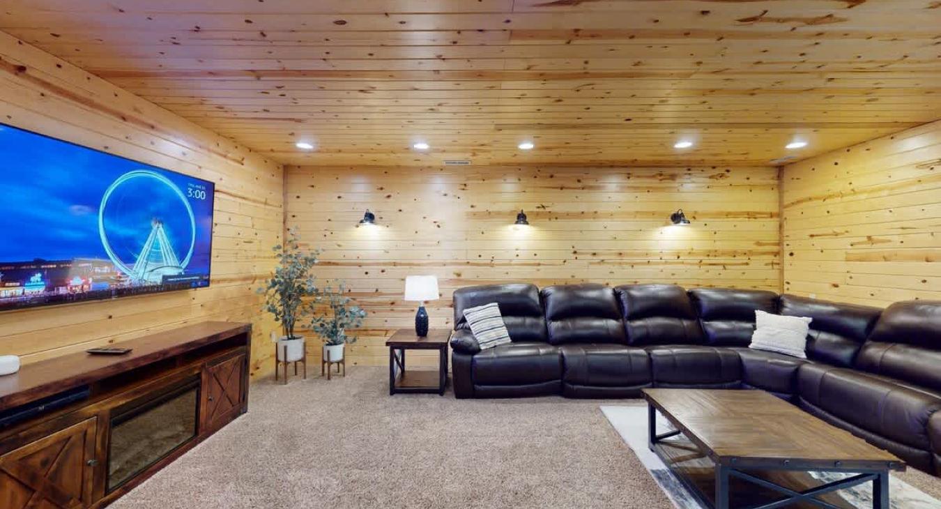 The tv is located across from the couch to be able to relax after a long day in the park.