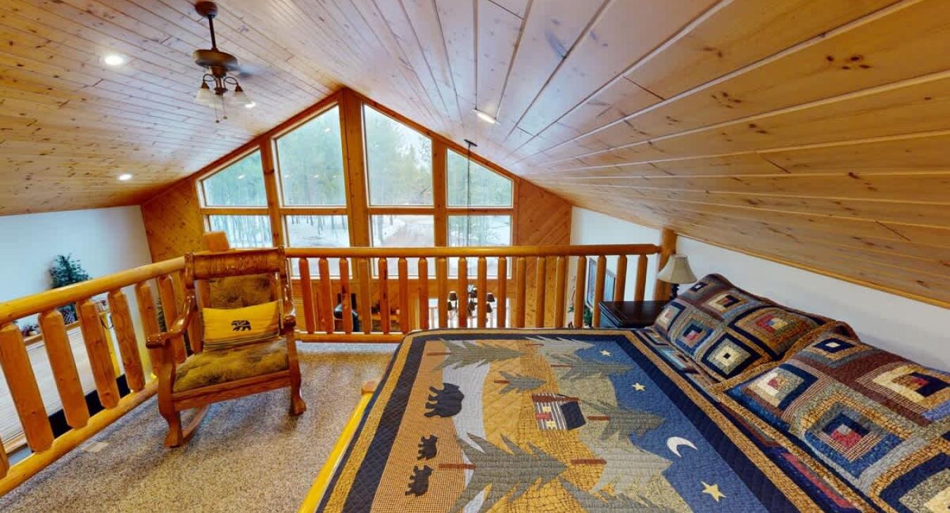 Upstairs loft with a Queen size bed.