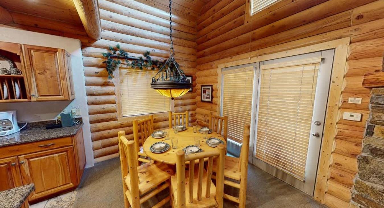 Dining room area with seats for 6  with additional seating at the kitchen island.