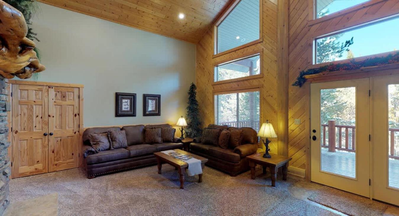 Living room is set up with lots of seating for everyone to relax during your stay.