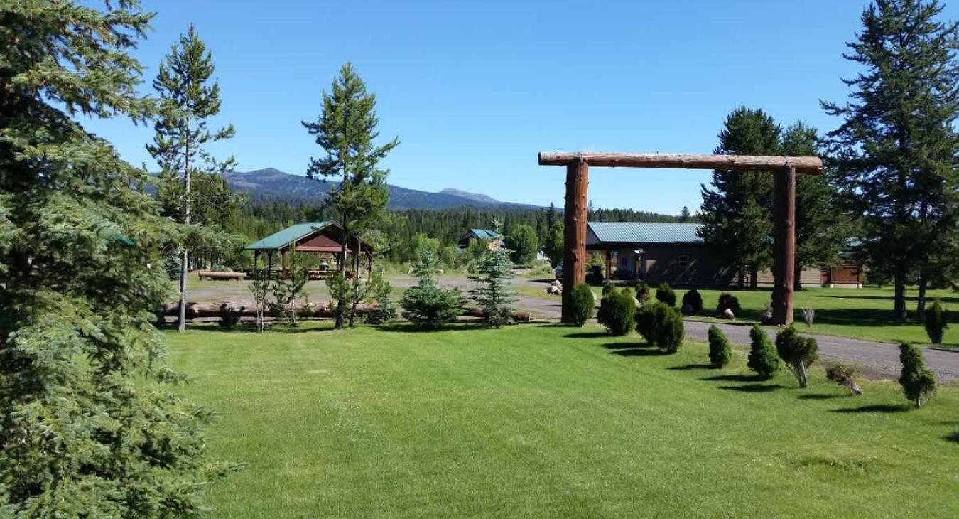 This cabin is nestled in Yellowstone Lux that is full of greenery.