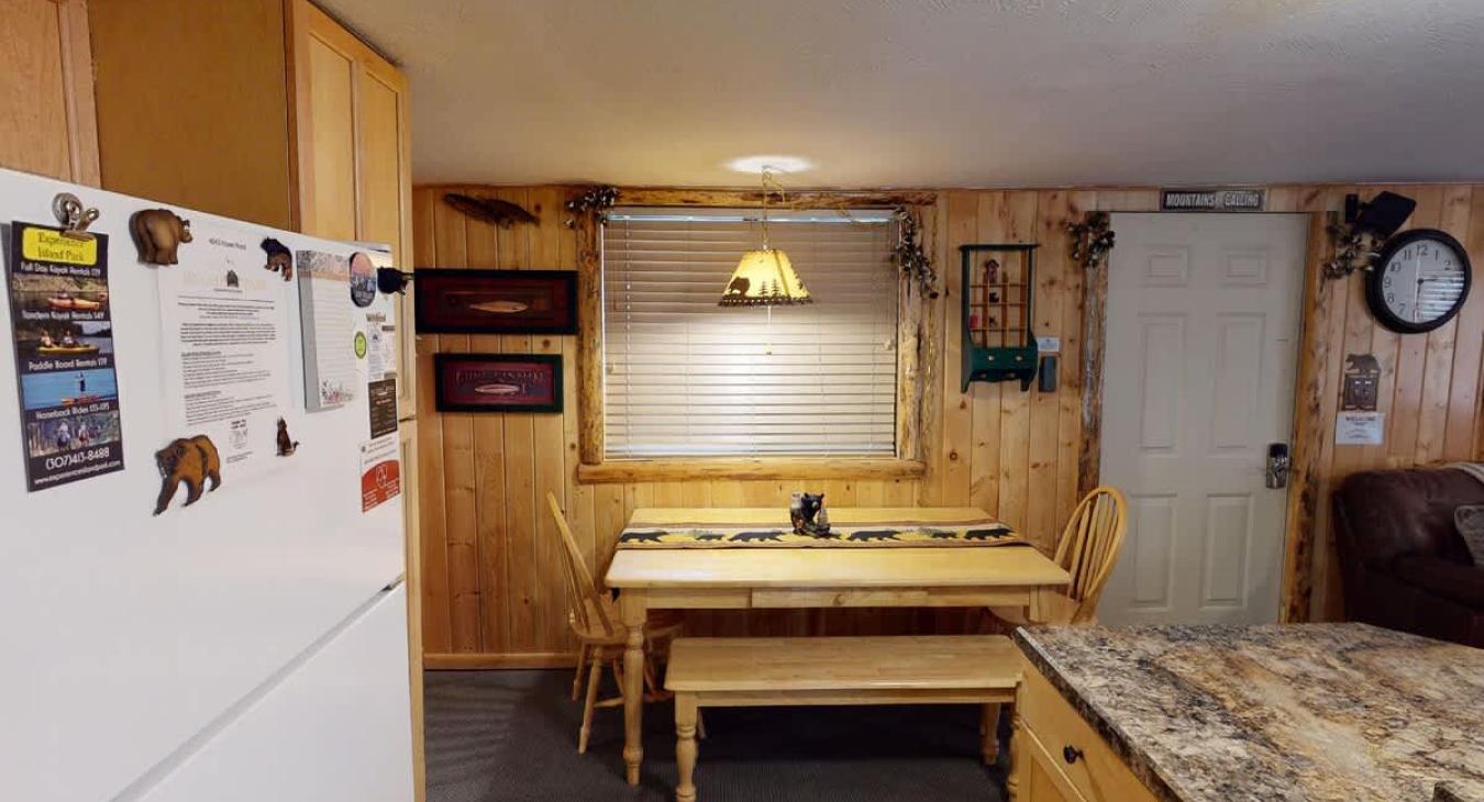 Dining room table that seats 4 people is located adjacent to the kitchen.
