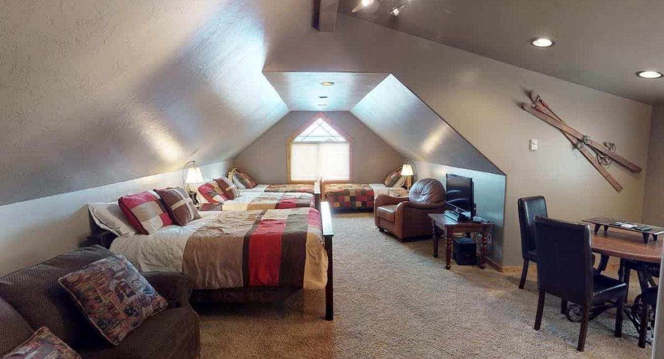 Above the garage is a small living area with 2 double beds and 2 twin beds.