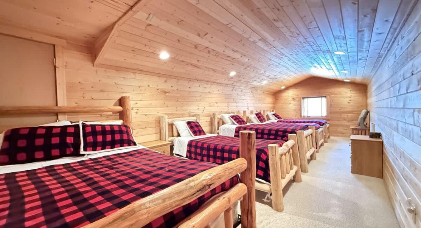 Kids bedroom with 3 twins and 1 full.