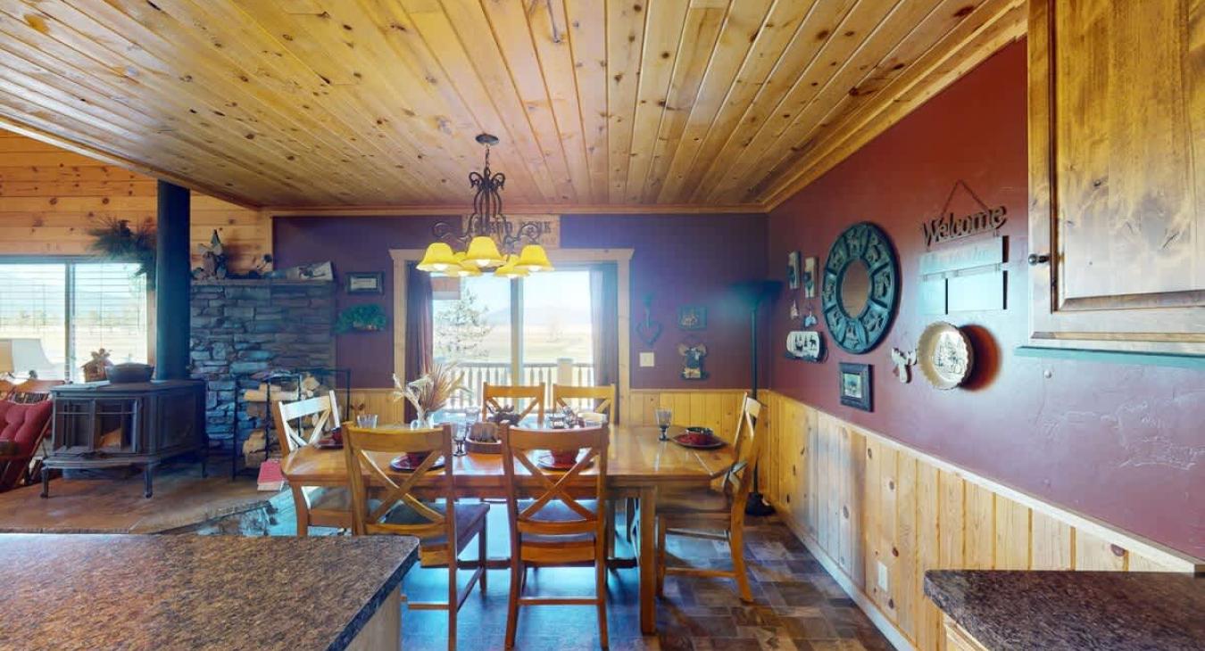 Sliding glass doors are located in the dining area to access the deck.