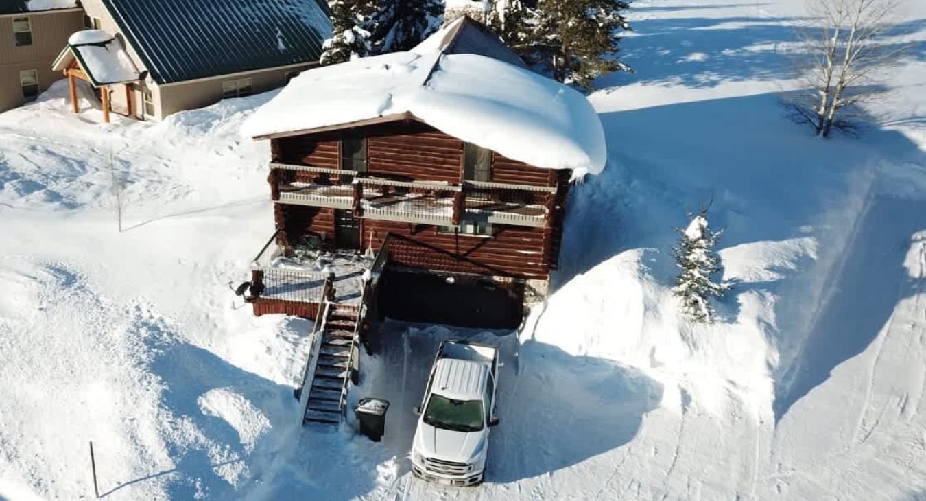 Aerial shot of the cabin in the winter.