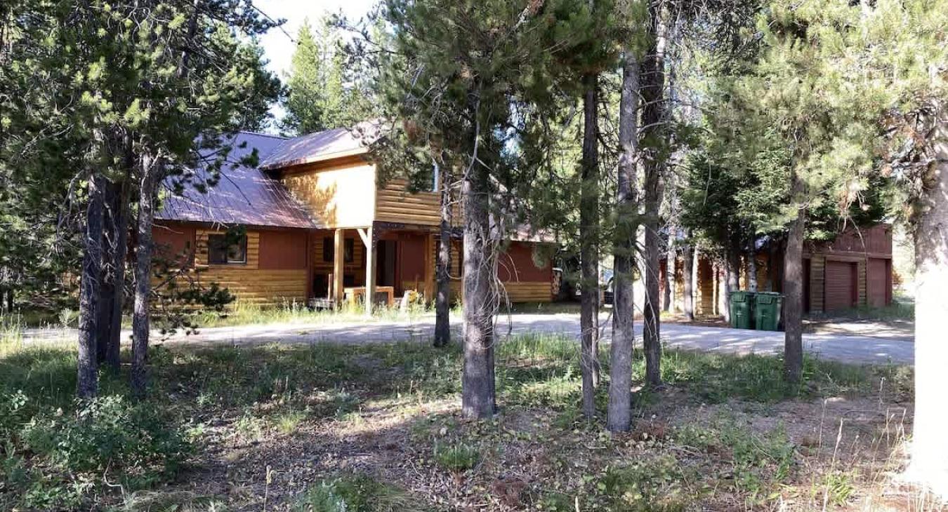 The Bears Den is located on a wooded lot in Macks Inn area.