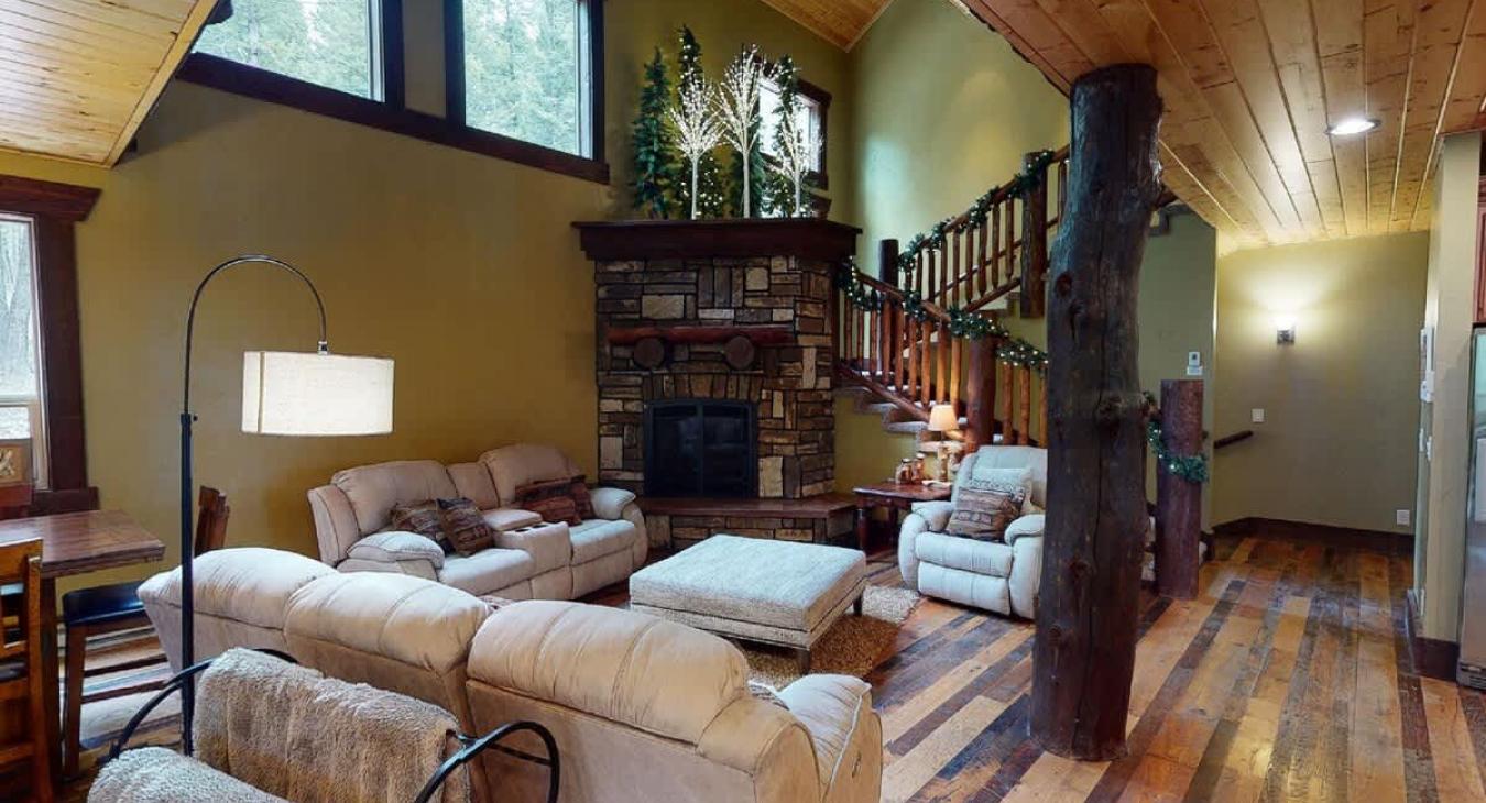 Upon entrance you are greeted by the living room with a fireplace and seating.