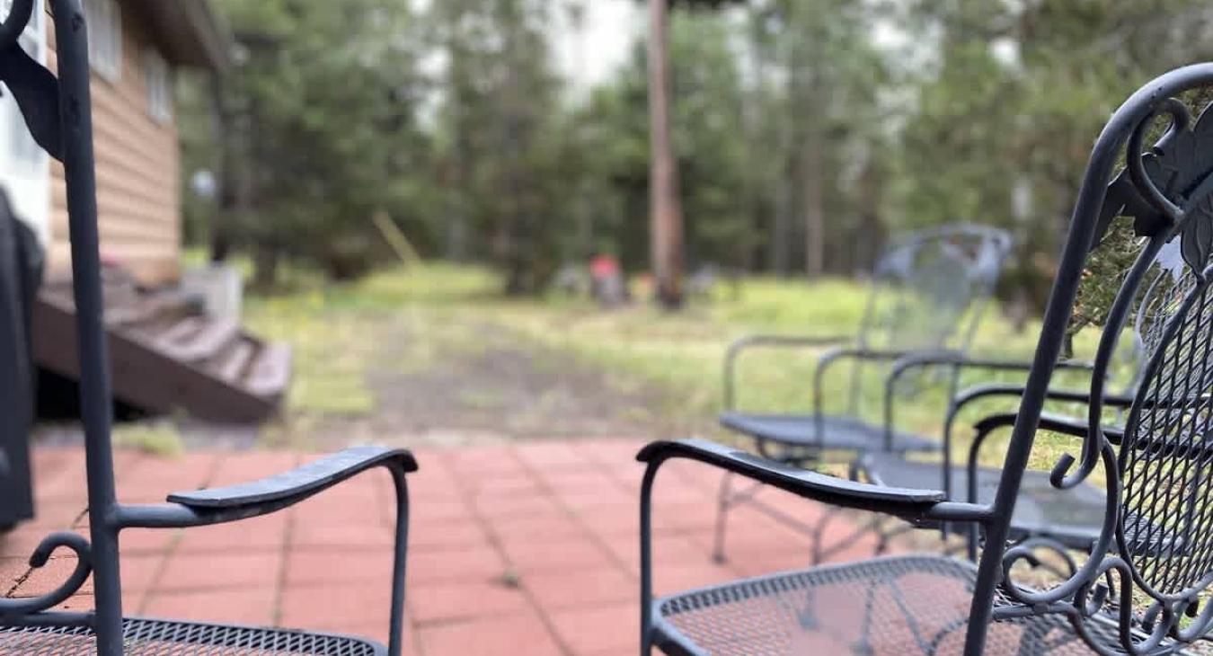 Patio with chairs for you to enjoy around the fire pit.