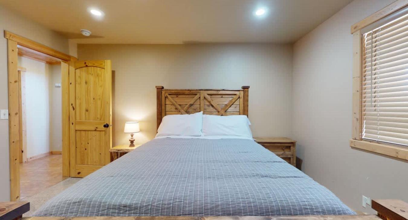 Master bedroom located downstairs.