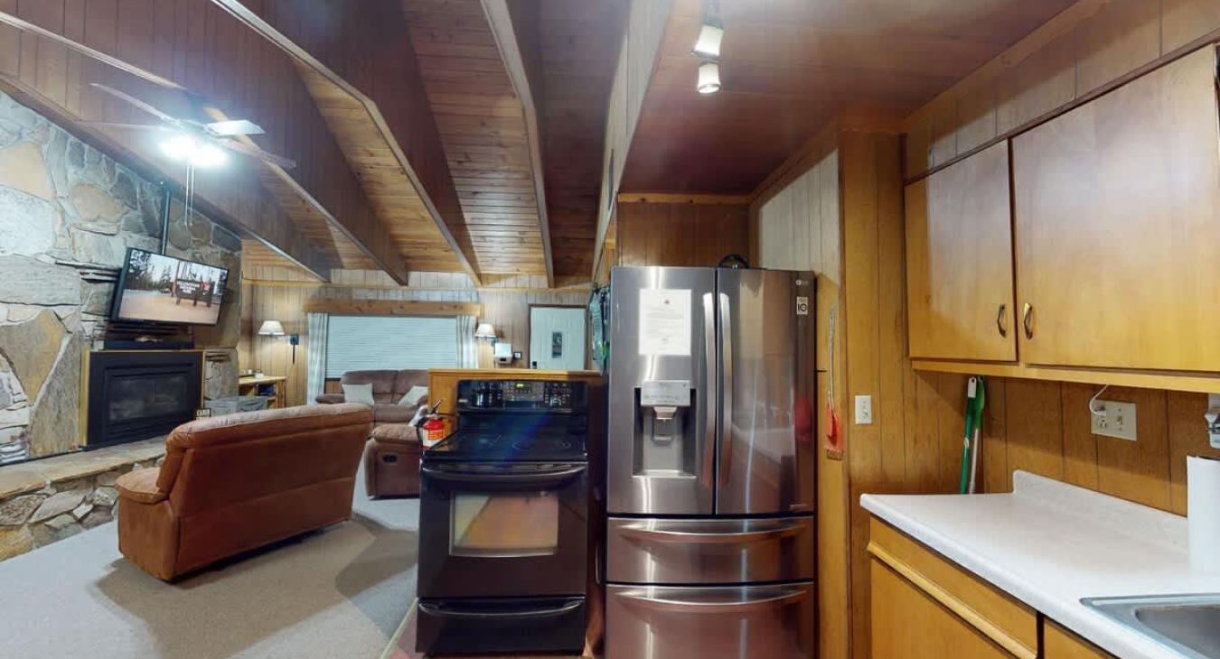Kitchen with basic appliances and spices.