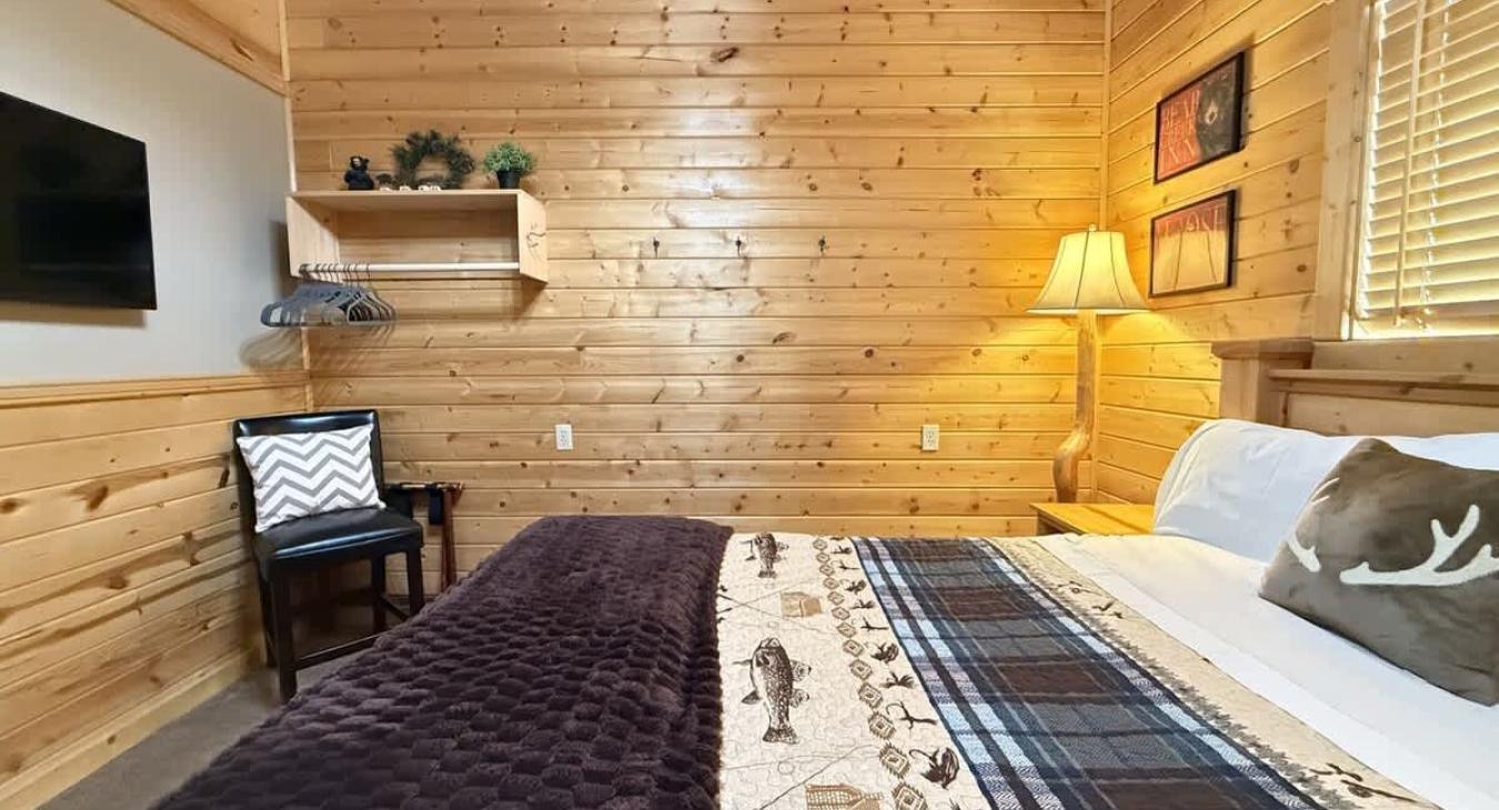 Imagine a cozy cabin bedroom that instantly makes you want to curl up and stay awhile.