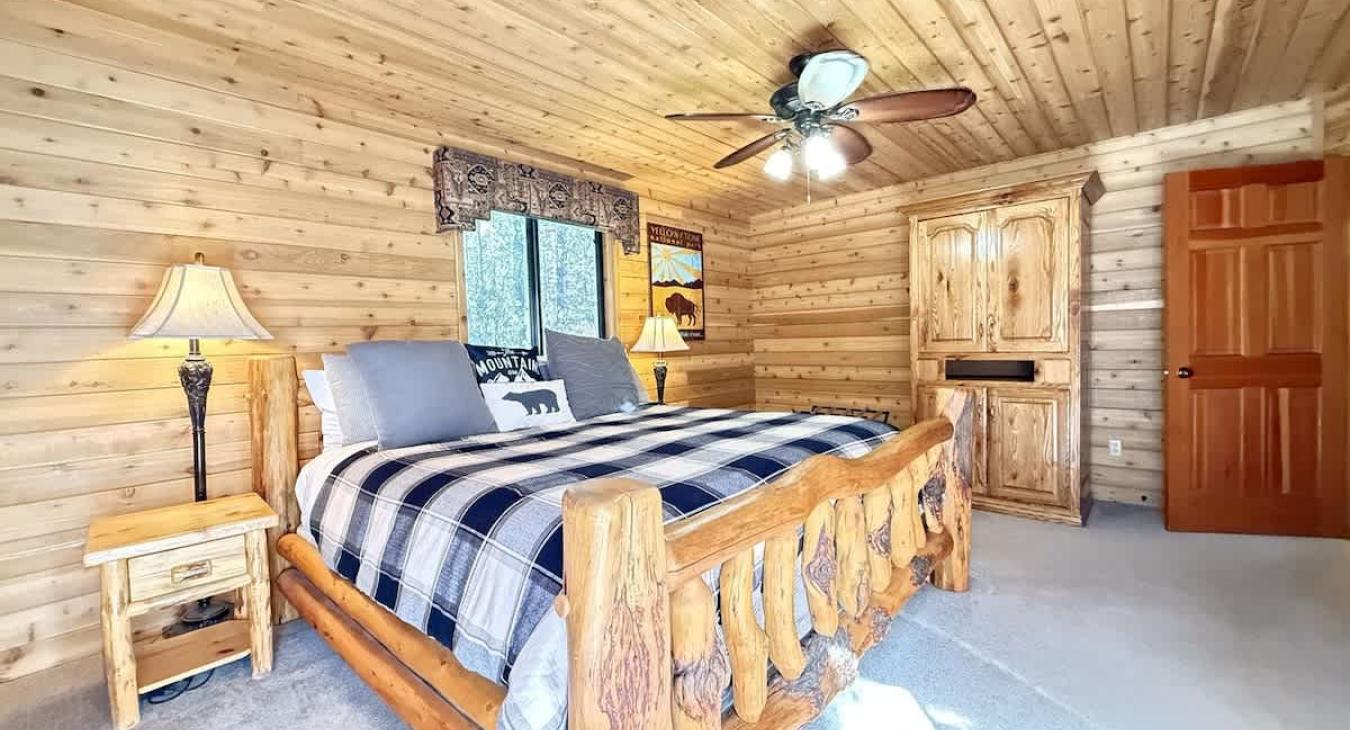 Master bedroom with king size bed on main floor. Fire in the fire pit