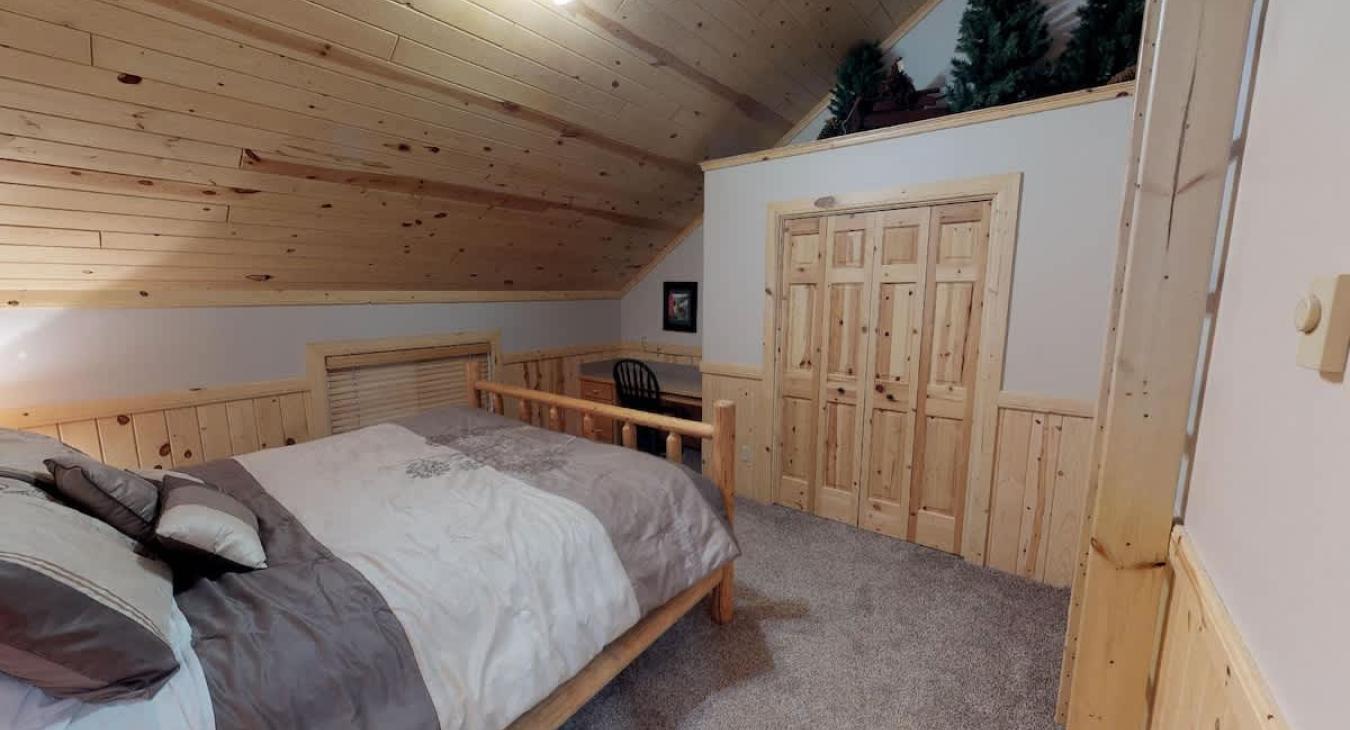 Bedroom #5 located upstairs with a King size bed.