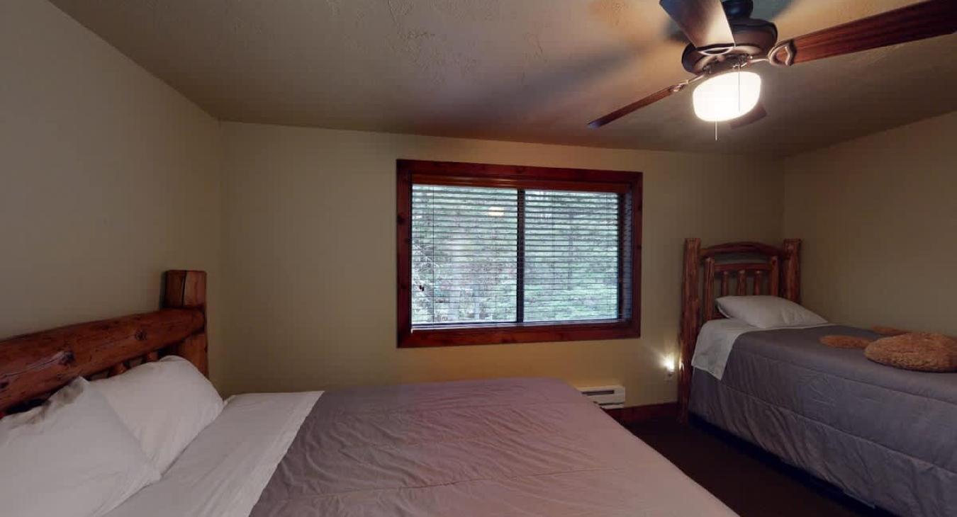 The second bedroom features a queen bed and a twin trundle bed. Perfect for up to 4 people.