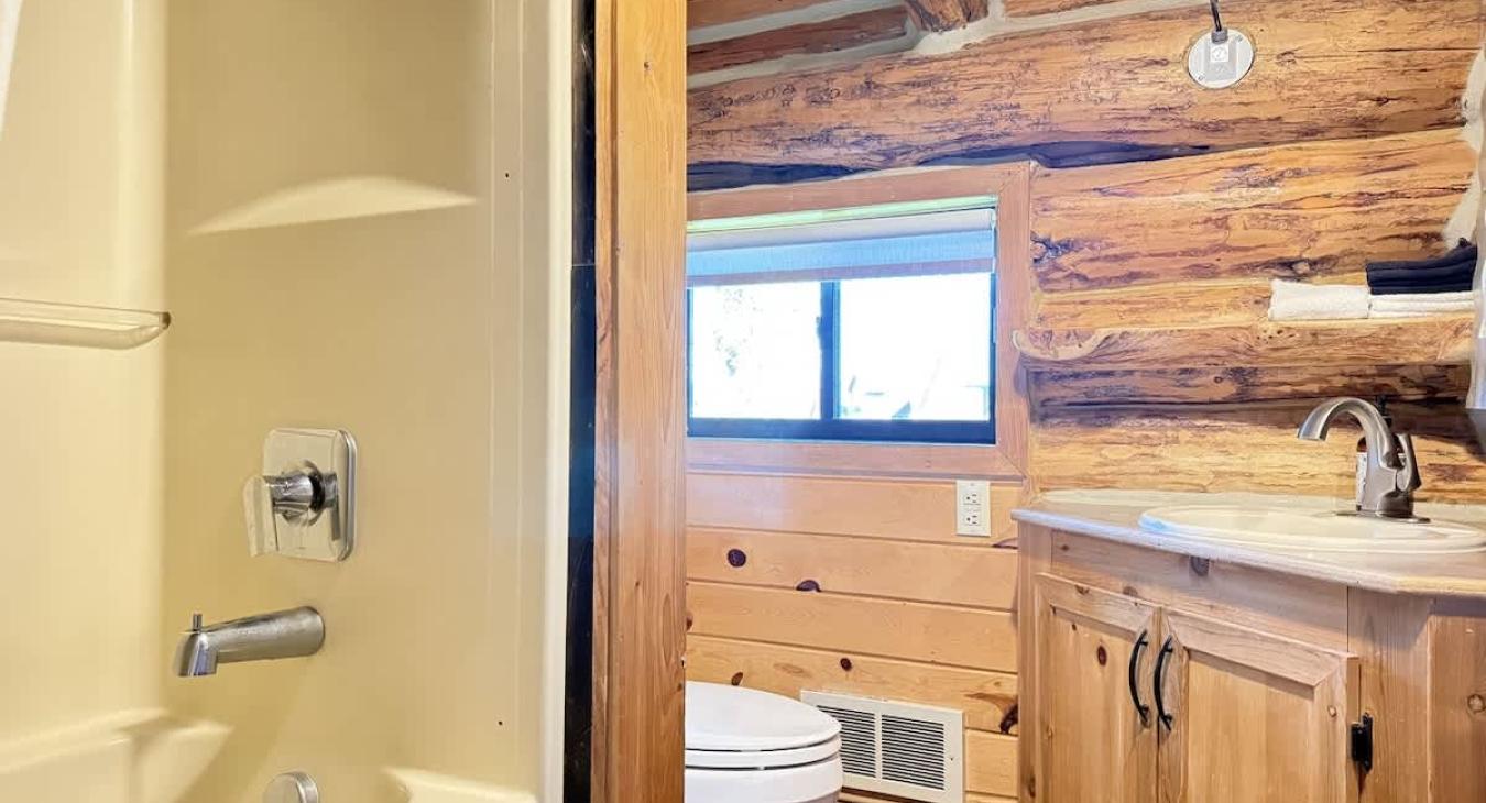 Bathroom upstairs with beautiful vanity and storage beneath for your items.