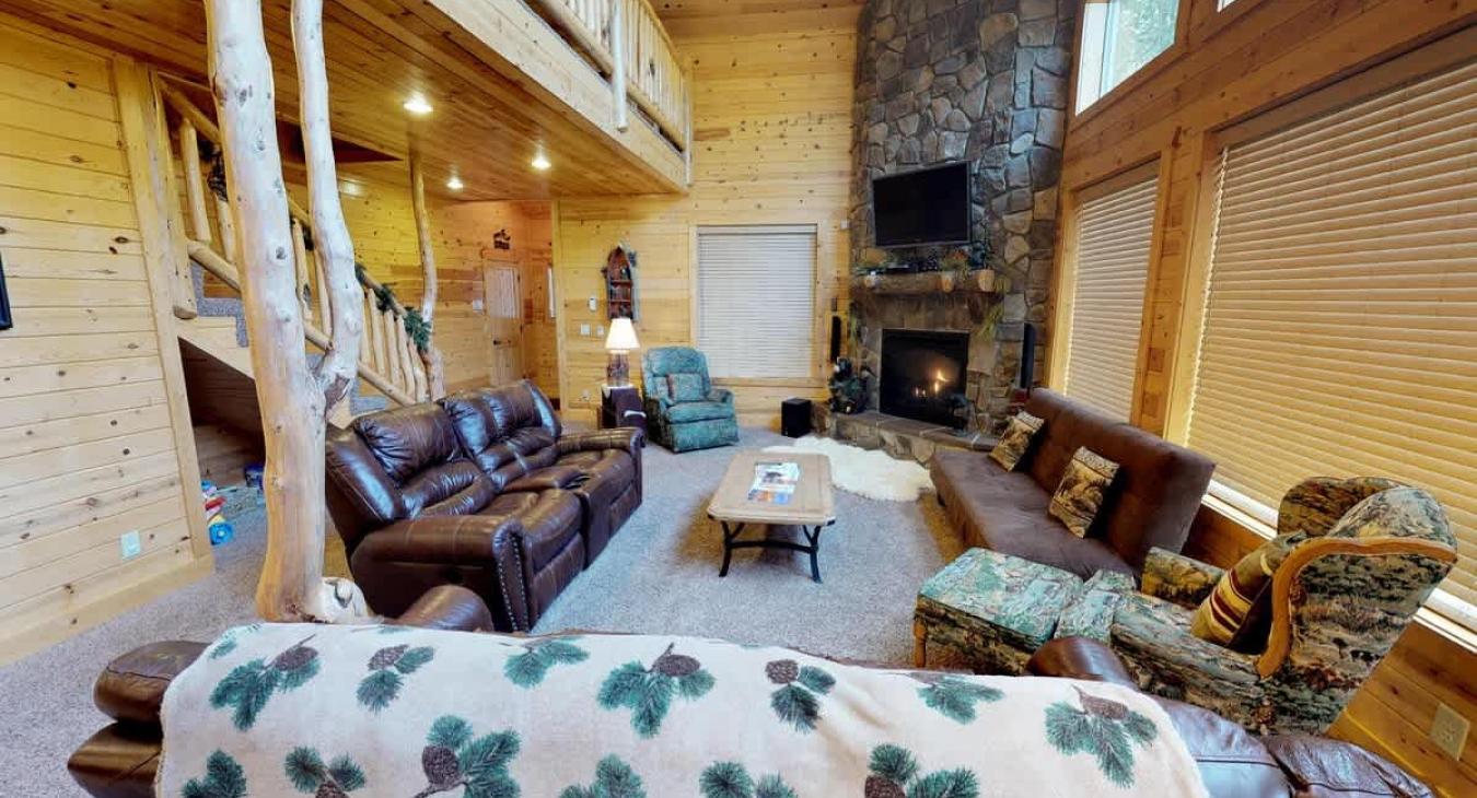 Upon entrance you are greeted by the living room that is very open to the rest of the cabin.