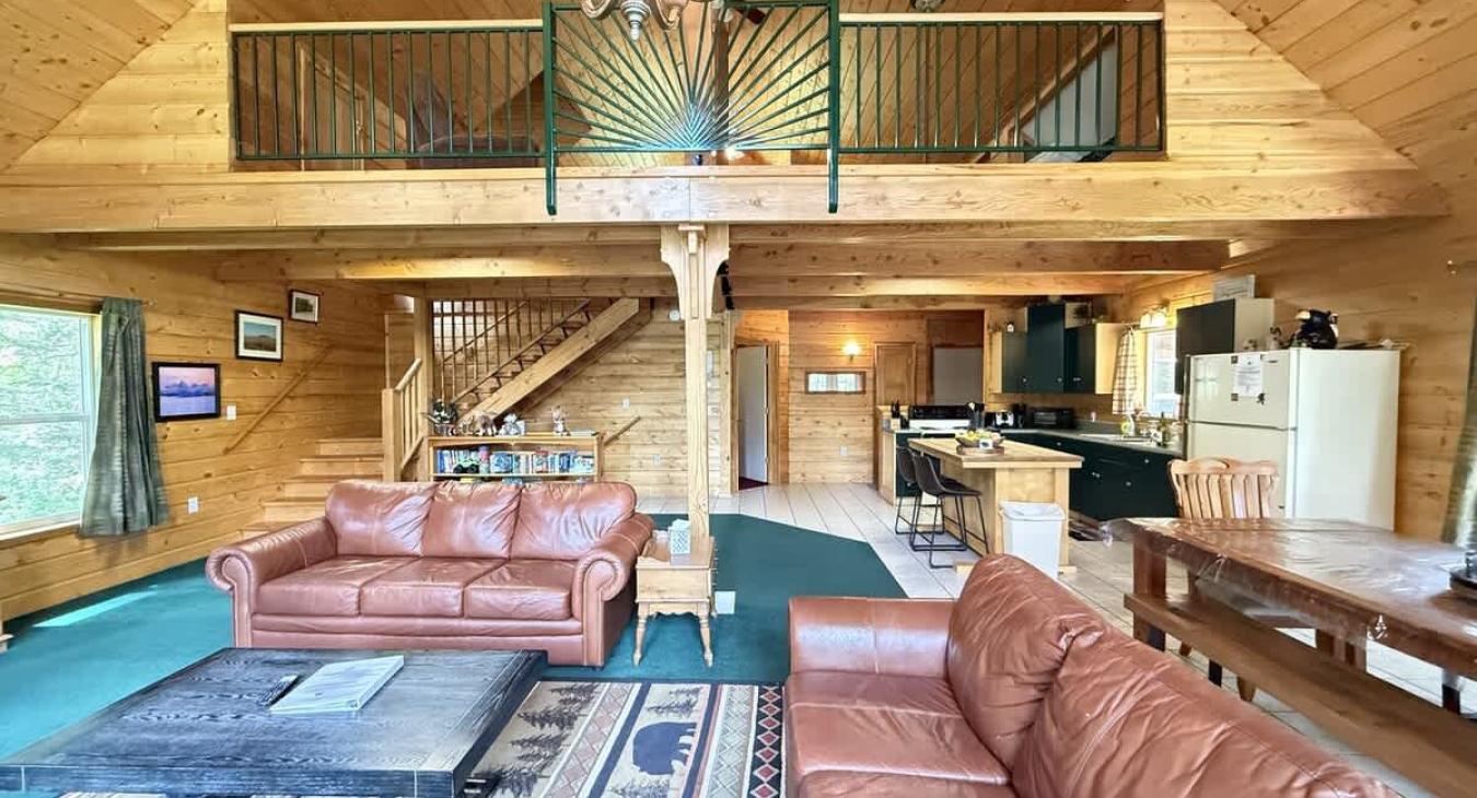 Spacious living room with fireplace for you to enjoy.