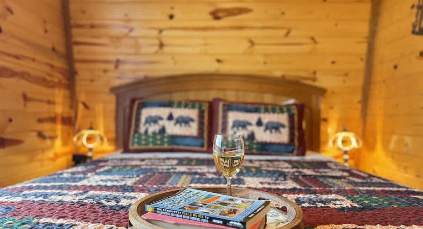 Relax in bed with a glass of wine and a good book.