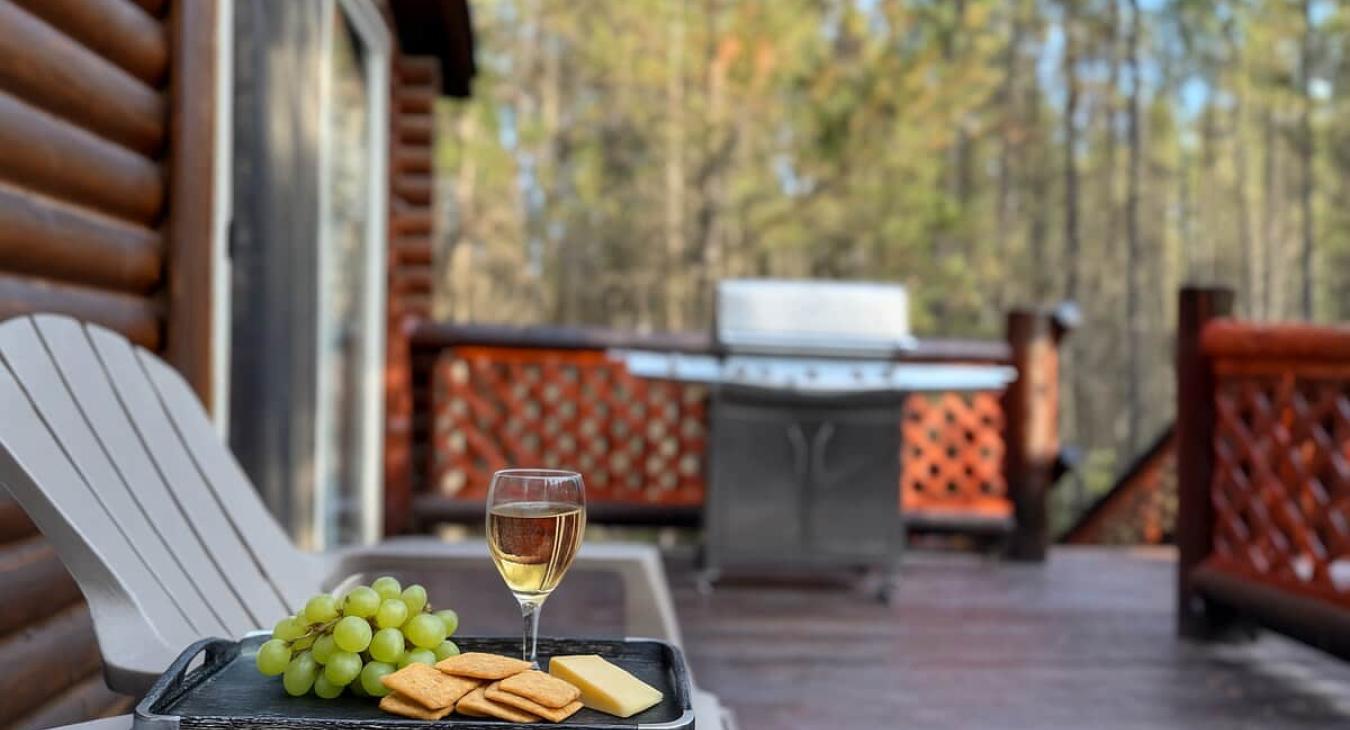 Kitchen porch with seating and a propane grill