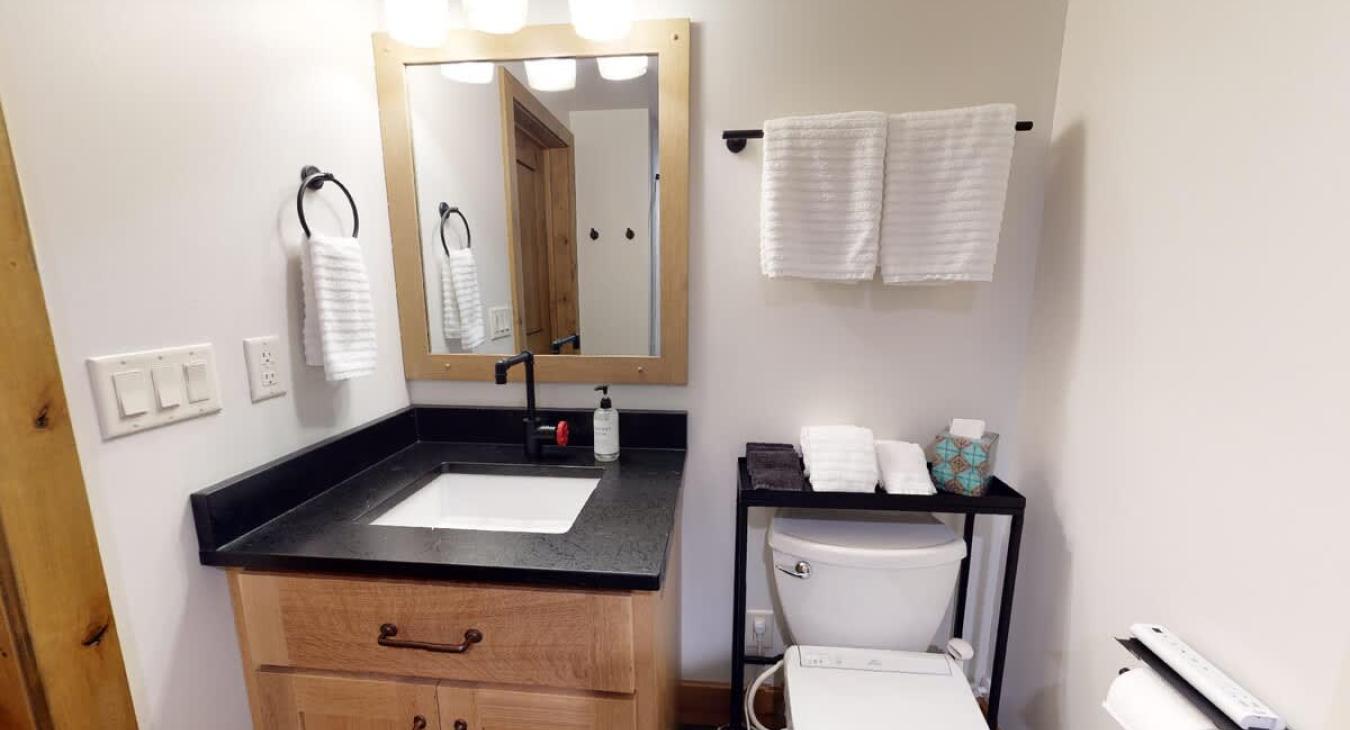 Bathroom toilet is equipped with advanced toilet seat. Clean towels and linens are provided for your stay.