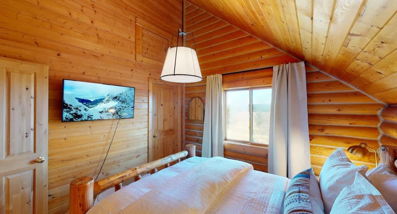 Bedroom #4 located upstairs with a Queen size bed.