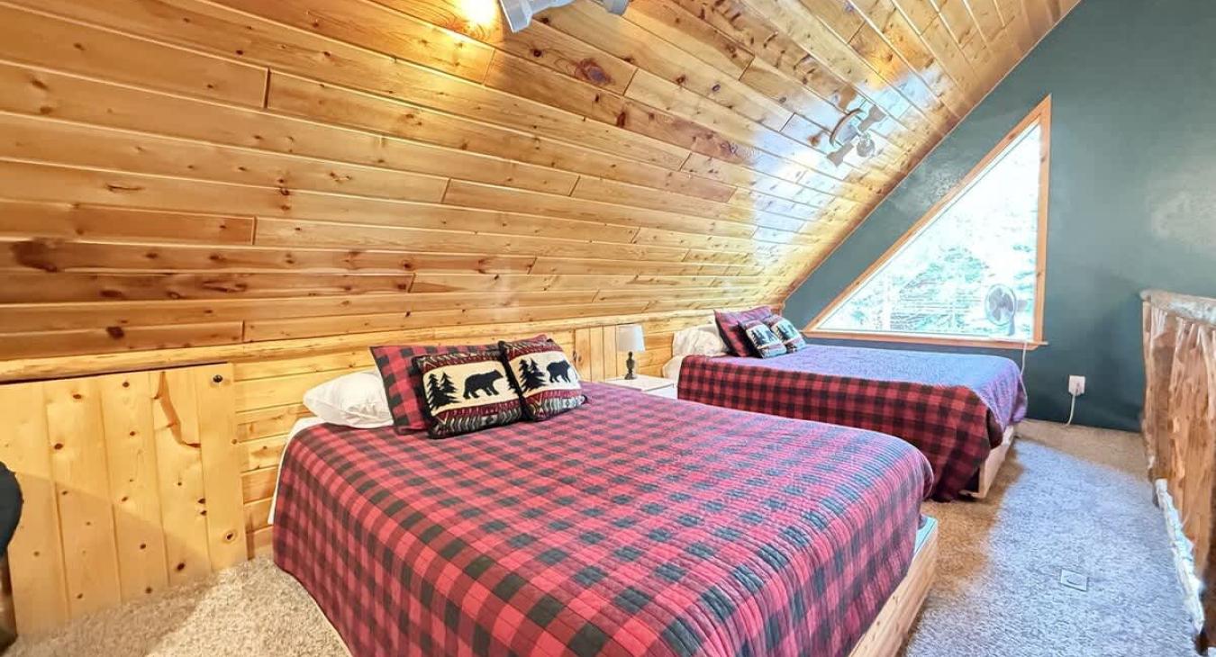Upstairs loft with 2 queen beds to comfortably sleep 4 people.