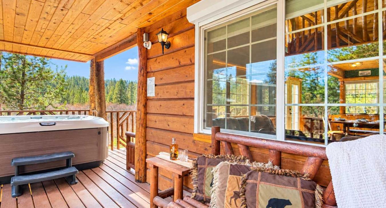 Porch view of sitting area and the hot tub.