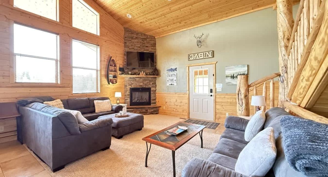 Natural light pours in through large windows, tying it all together with a view of the forest just beyond.