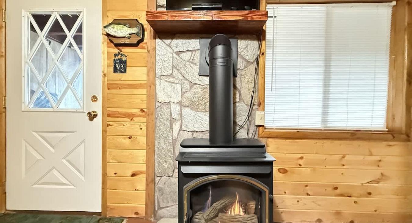 Basement living room area gas fireplace and TV