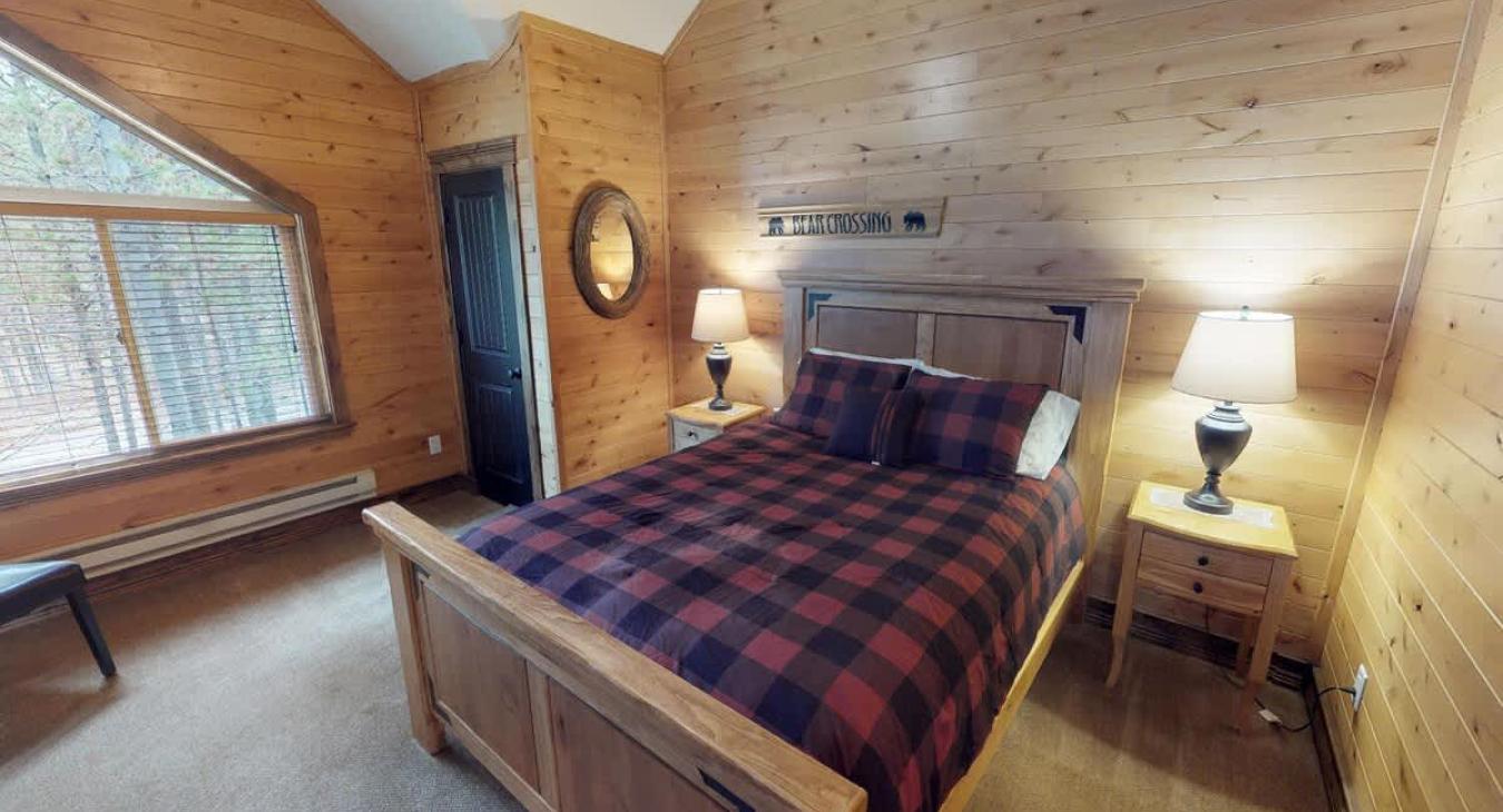 Bedroom #1 located on the upstairs level with a Queen size bed in the room.