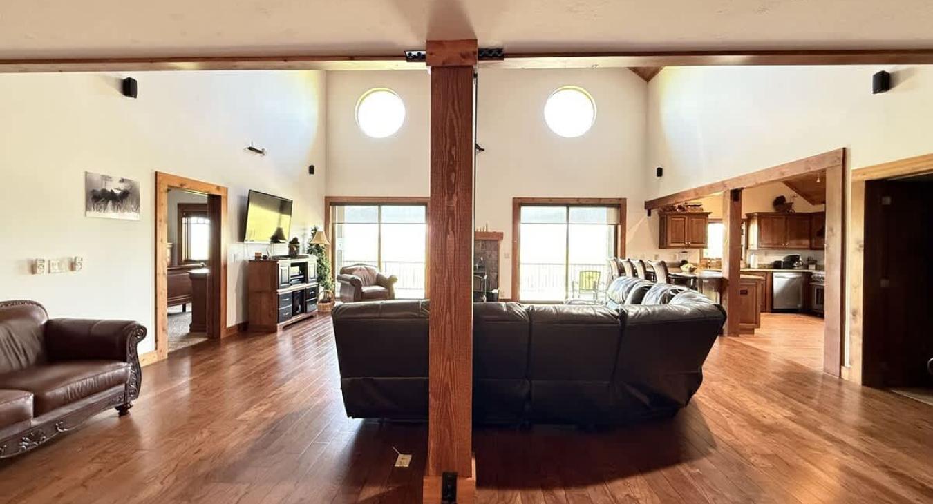 Natural light pours in through large windows, tying it all together with a view of the forest just beyond.